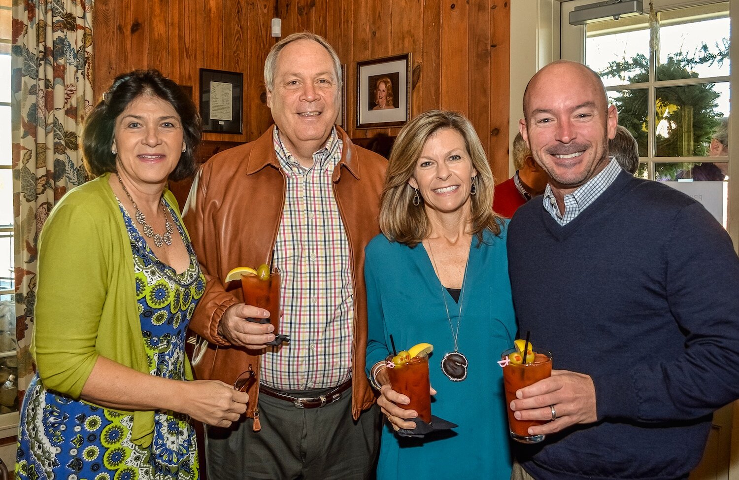 commercial two couples holding drinks and smiling