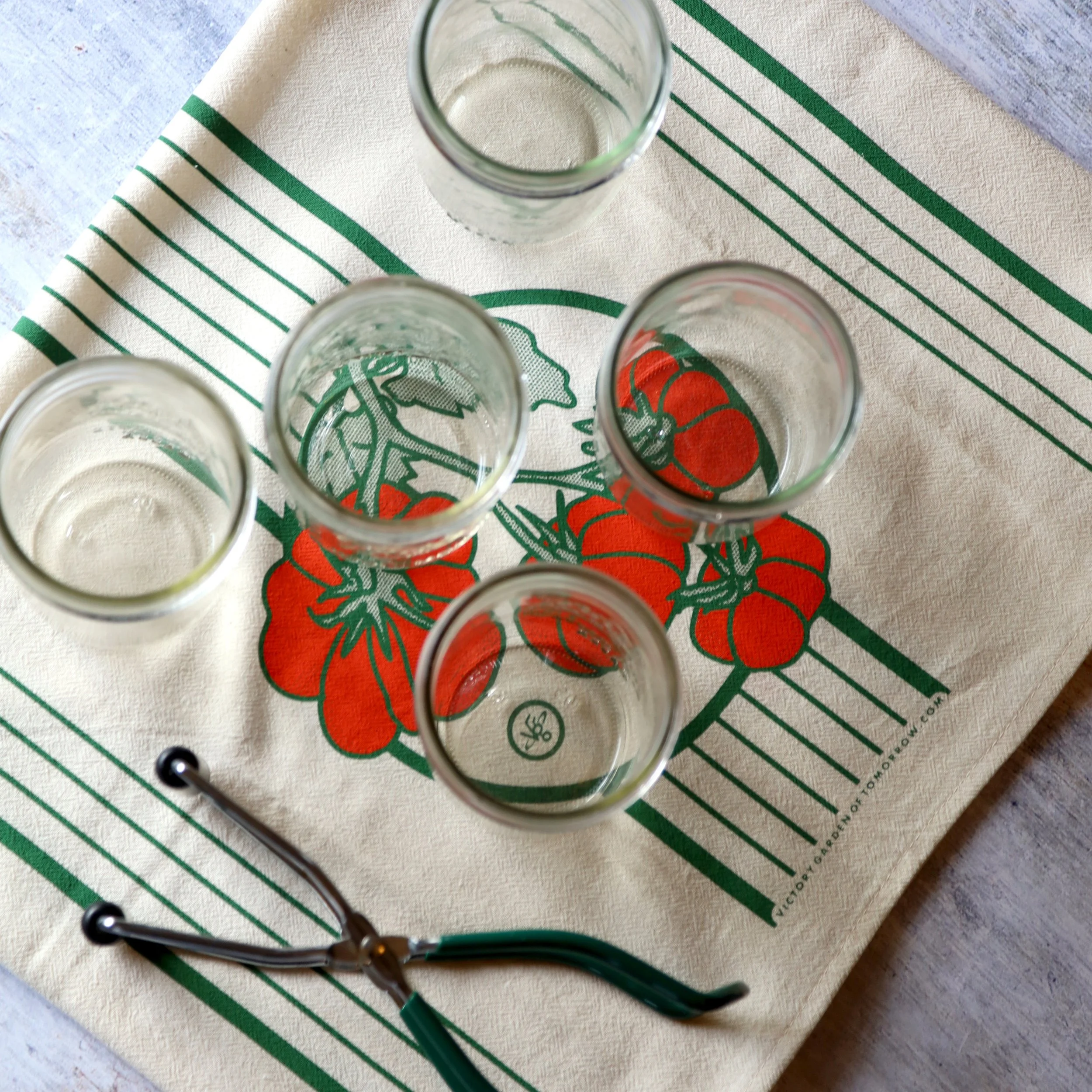 Floursack towel with a print of tomatoes and canning jars