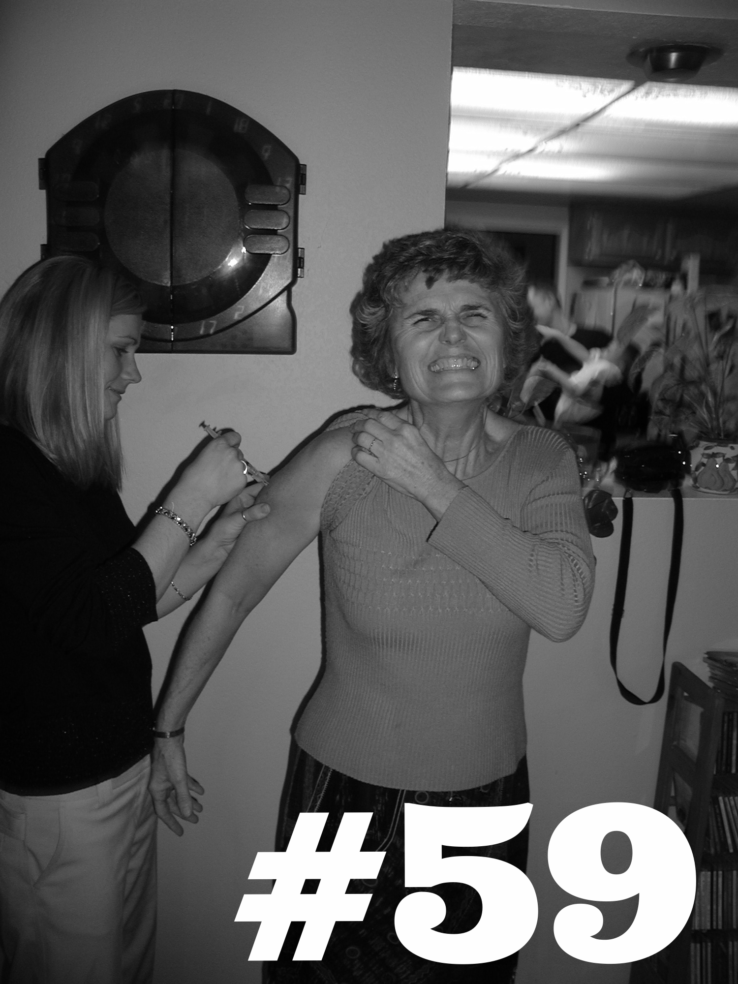 Covina, CA. Nurse Julie jabs Aunt Carol. Holiday flu shots! 2002