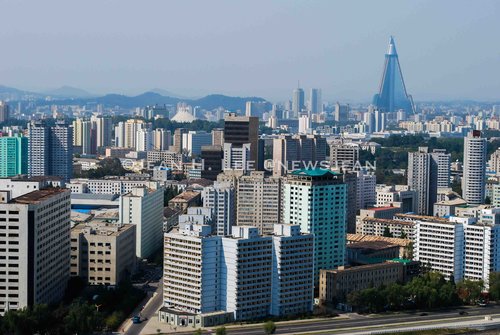 PYONGYANG, North Korea -- A view of downtown Pyongyang, North Korea, with the towering Ryugyong Hotel in the background, in September 2009. (Photo credit: Jean H. Lee. All Rights Reserved)