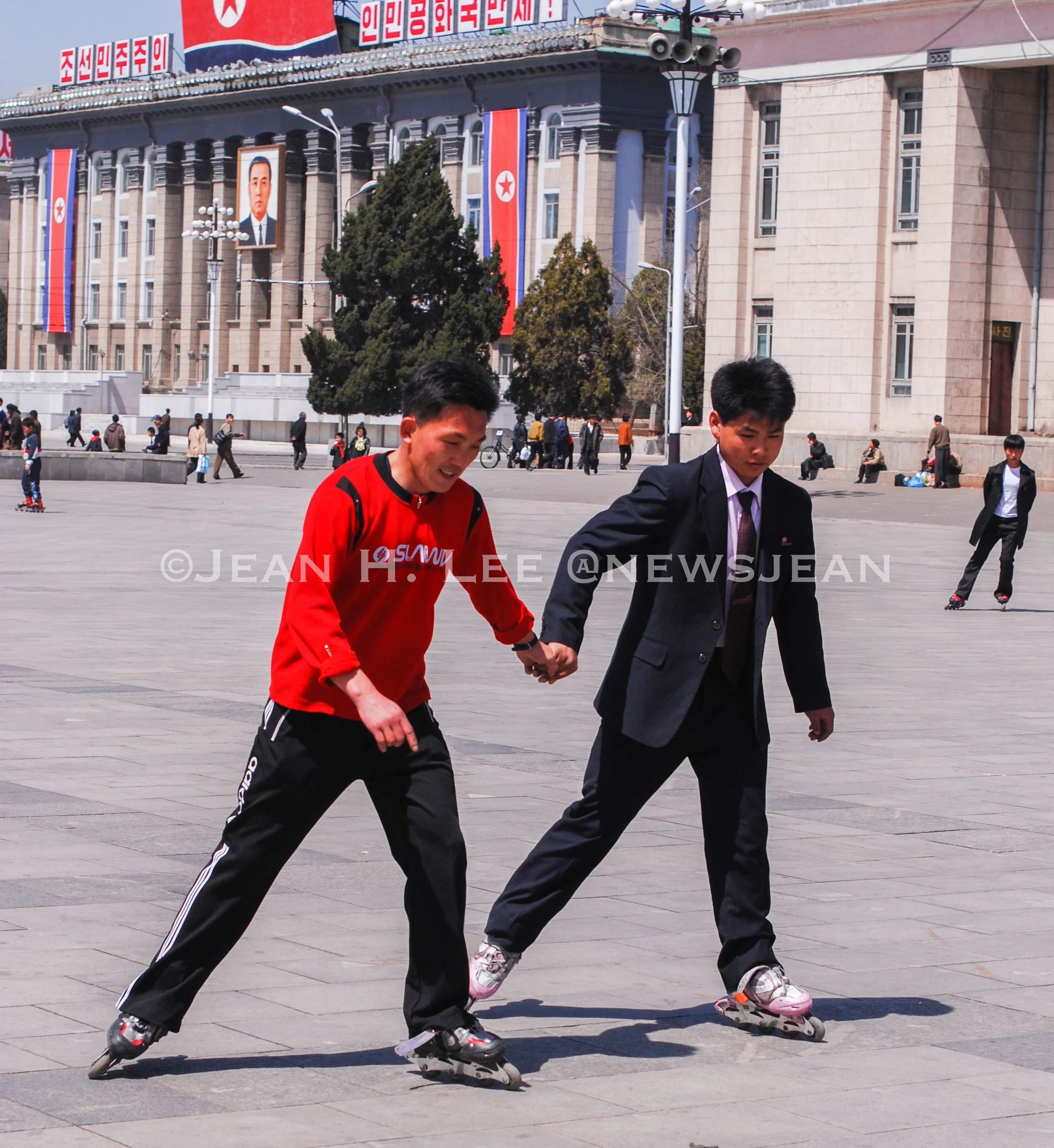 North Koreans inline skating on Kim Il Sung Square in Pyongyang. Photo credit: Jean H. Lee. All Rights Reserved.