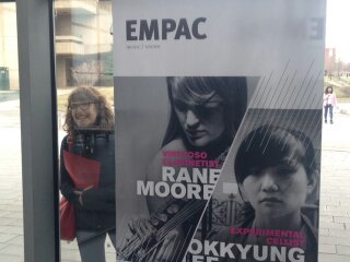  Large face/small face - next to an advertisement at EMPAC 