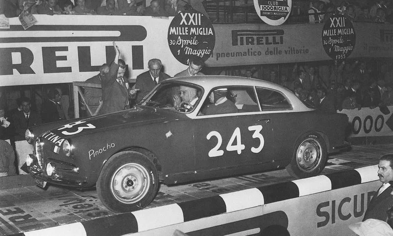 A small-displacement Alfa leaving in the early hours (as told by the car number)