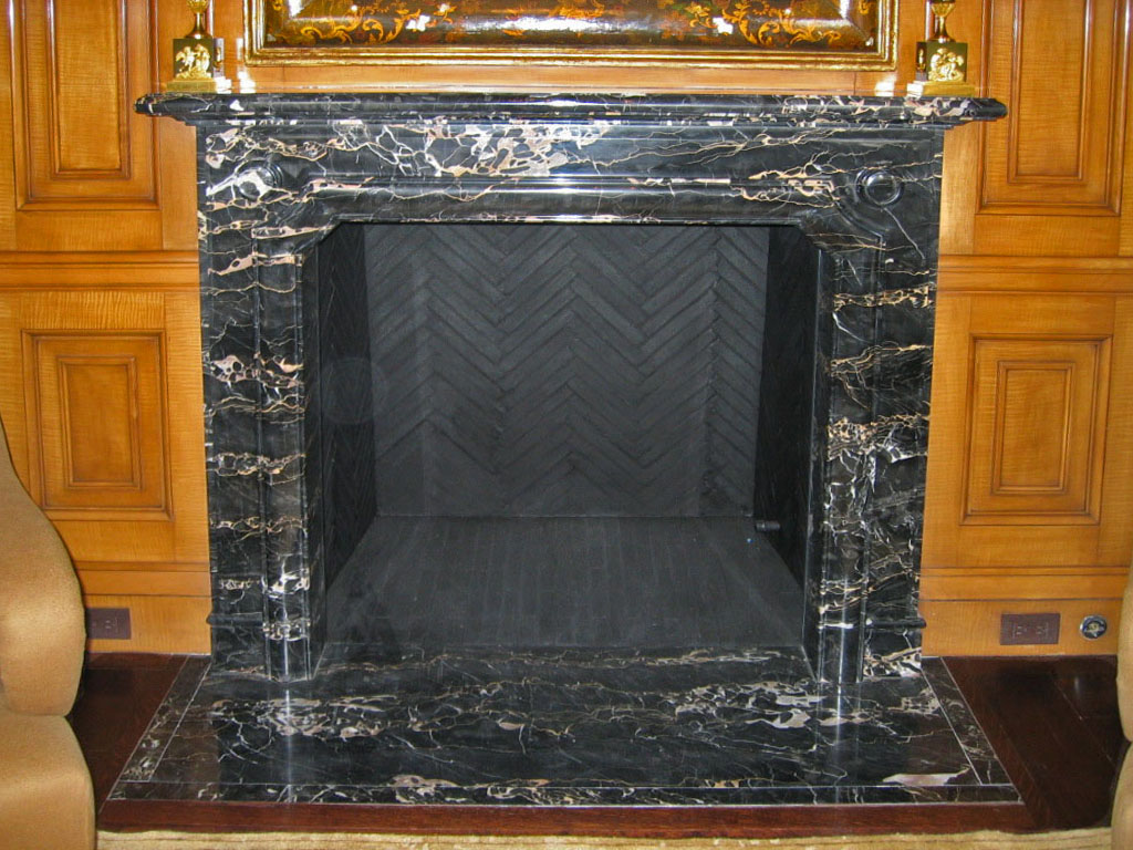 fireplace surround in nero potoro marble