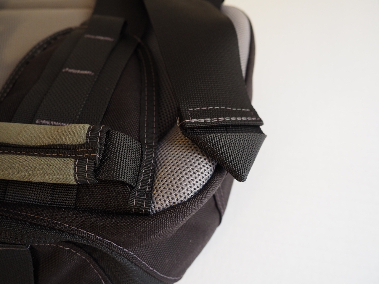 Note how the end of the strap is folded over into a triangle