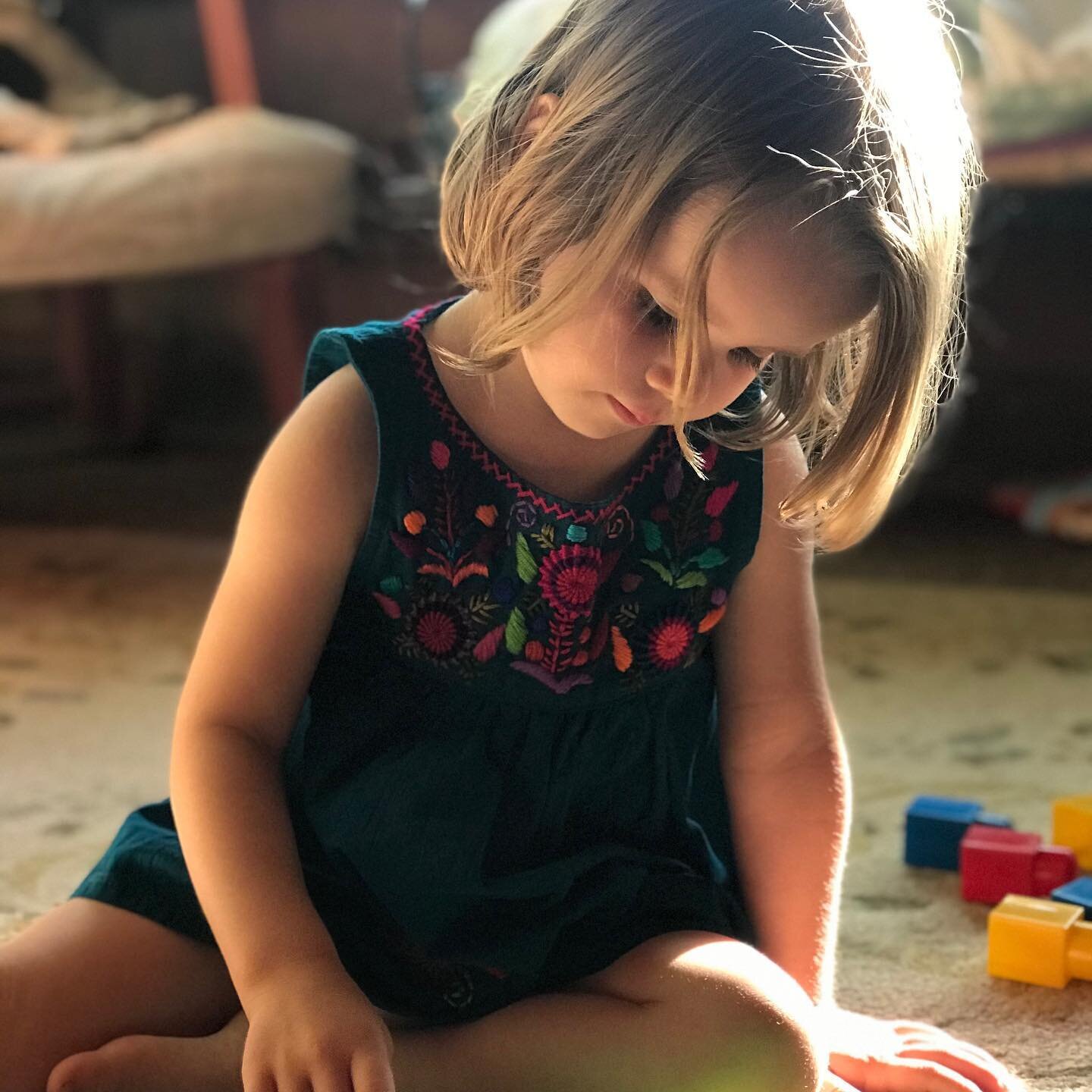 What&rsquo;s it like to be three years old? On the porch at the cabin in her #newmexico dress. #wonder #laughter #twogrownhumansattendingyoureveryneed