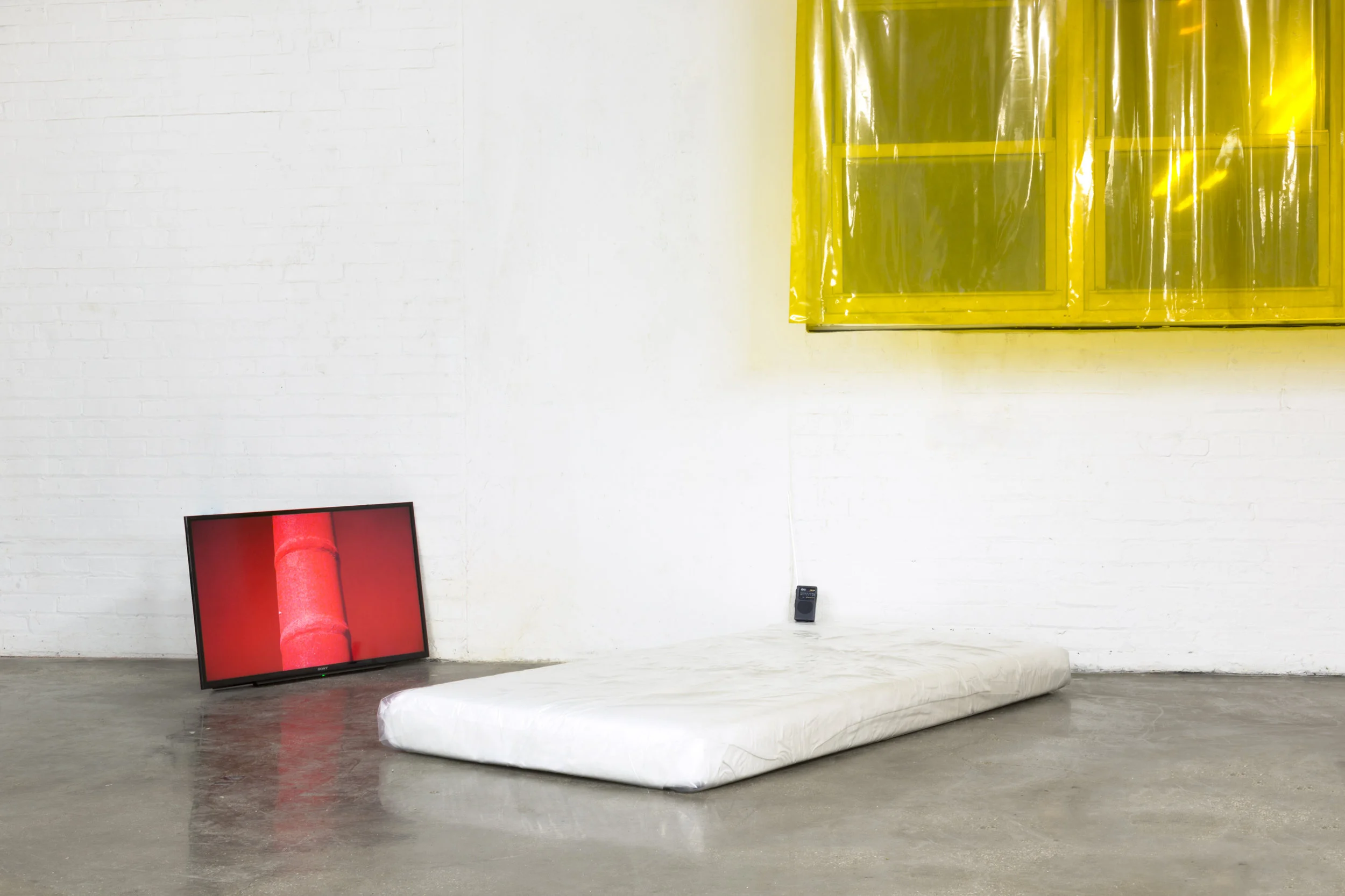 Hanging out 2018 Works in collaboration with Kristine Eudey Video, foam, plastic sheeting, radio, PVC welding curtains, slept-on copper, vinegar, found steel