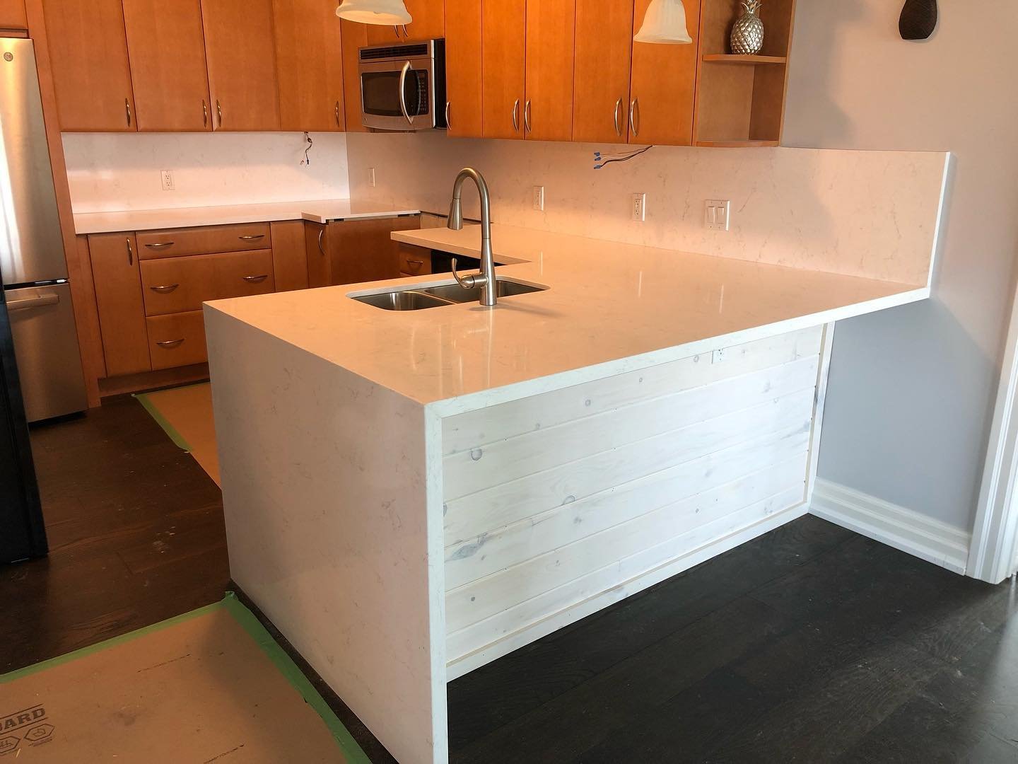 LG Viatera Forte quartz kitchen countertops with waterfall and full height backsplash