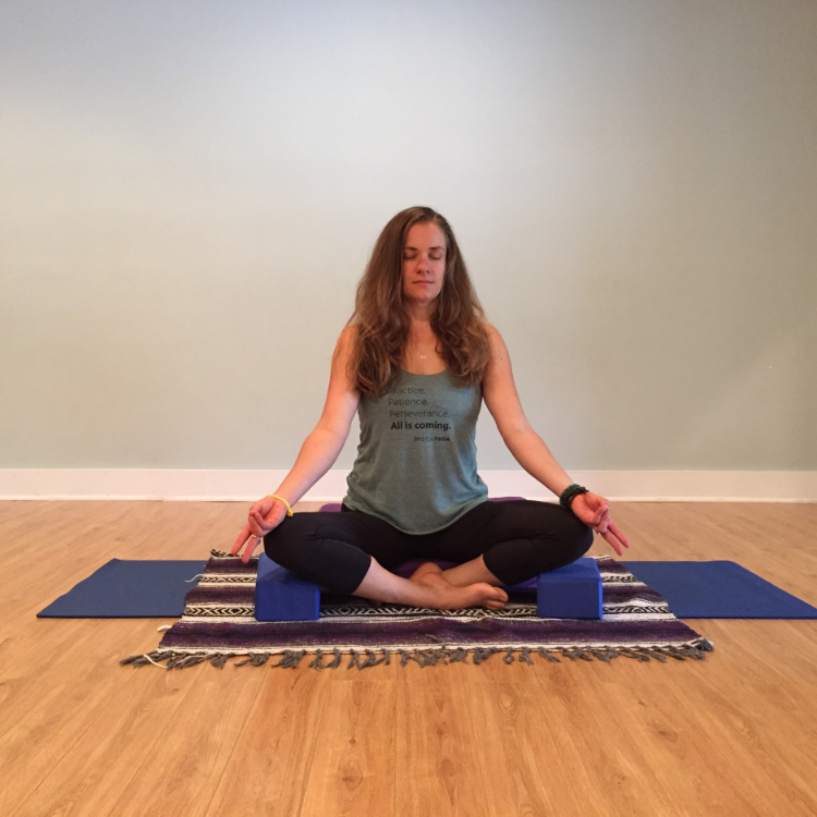 Demonstrated here is a traditional method of meditation, finding a comfortable seat with eyes closed. Here, Shelly holds the pranayama mudra, touching the ring and pinky finger lightly to the thumb, as she focuses on her breath.