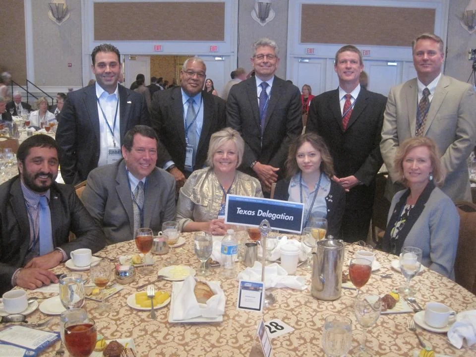 Members of the Irving Texas Delegation at the Dream Big Small Business of the Year Awards luncheon include (top row) – Blue Ribbon Winner Adrian De Leon – La Margarita Restaurant, Blue Ribbon Winner Michael Christopher - Elemental Methods, Michael Gonzales – Chairman of the Chamber Board and President of Armstrong Relocation, and Blue Ribbon Winner Steve Wedler and Cary Albert – MATsolutions, (seated) Amir Mirabi – Director of Small Business Office for Governor Rick Perry, Blue Ribbon Winner Chuck and Karen Cooperstein – Cooksey Communications, and Blue Ribbon Winner Kiana and Jo Ann Goin – Glory House Catering.
