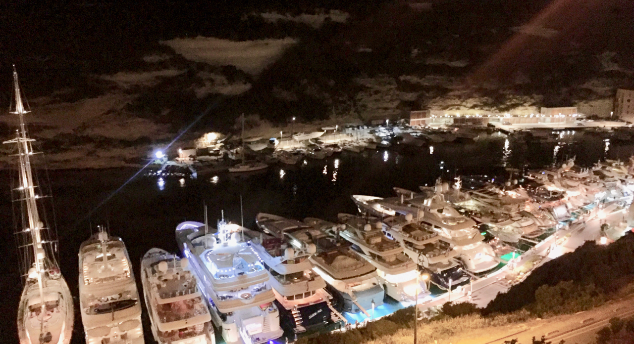 Bonifacio in the middle of August: party town. We left Peregrinus at its anchorage in Cala di Paragnanu, a mile-and-half west, and arrived by tender. Beyond the port, what looks like clouds is, in fact, limestone cliffs. 10:48pm, 14 August 2016, iPhone 6 Plus.