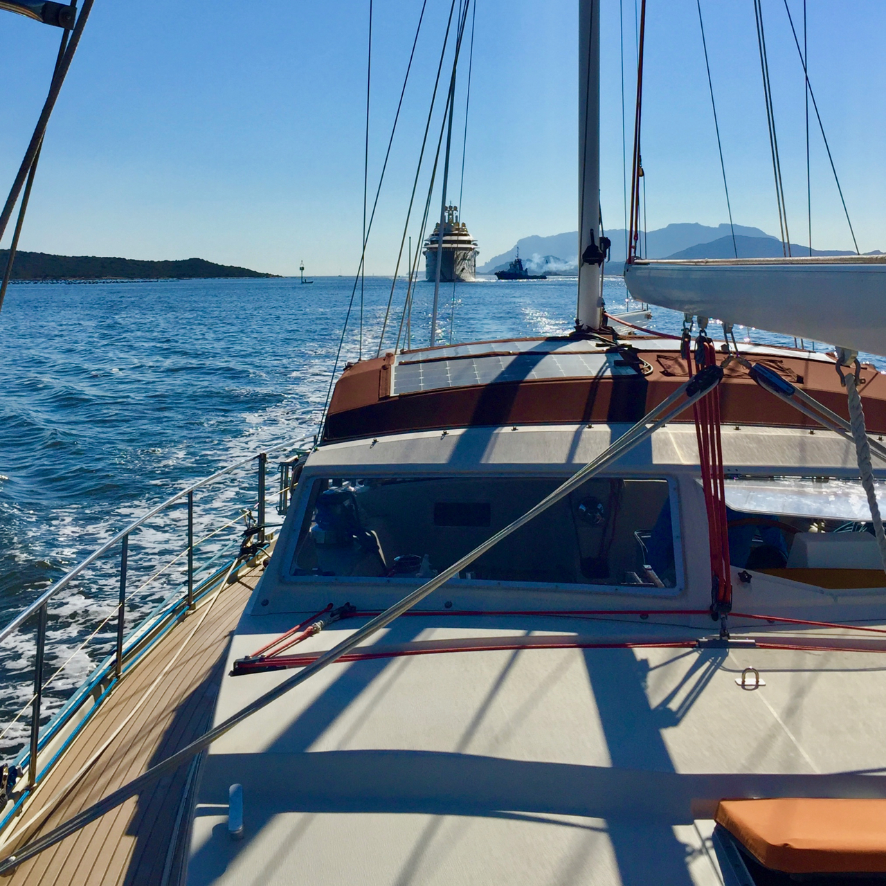 Objects in rearview mirror are closer than they appear. Dilbar hot on the heels of Peregrinus , and gaining! Port of Olbia access canal, Sardinia, 25 August 2016. iPhone 6 Plus.