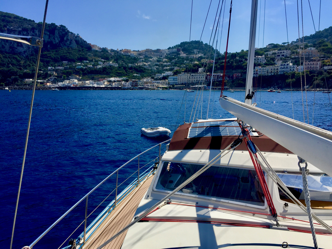  As sunset approached, we sailed around the island. We were offered a mooring buoy at the Grotta Azurra, but in the end decided to anchor at Marina Piccola. iPhone 6 Plus. 12 September 2016