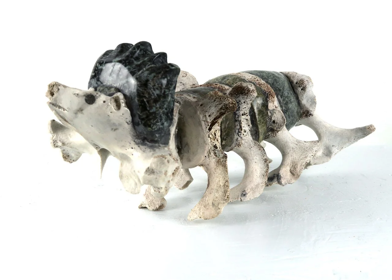  Pitseolak Qimirpik Transformation 12 x 4.5 x 5 Serpentine and Bone $ 1250 