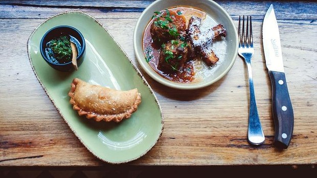 Sage and beef meatballs with tomato sugo and polenta pecorino fries, and lamb, prosciutto and broccoli empanada at San Telmo. IMAGE: supplied