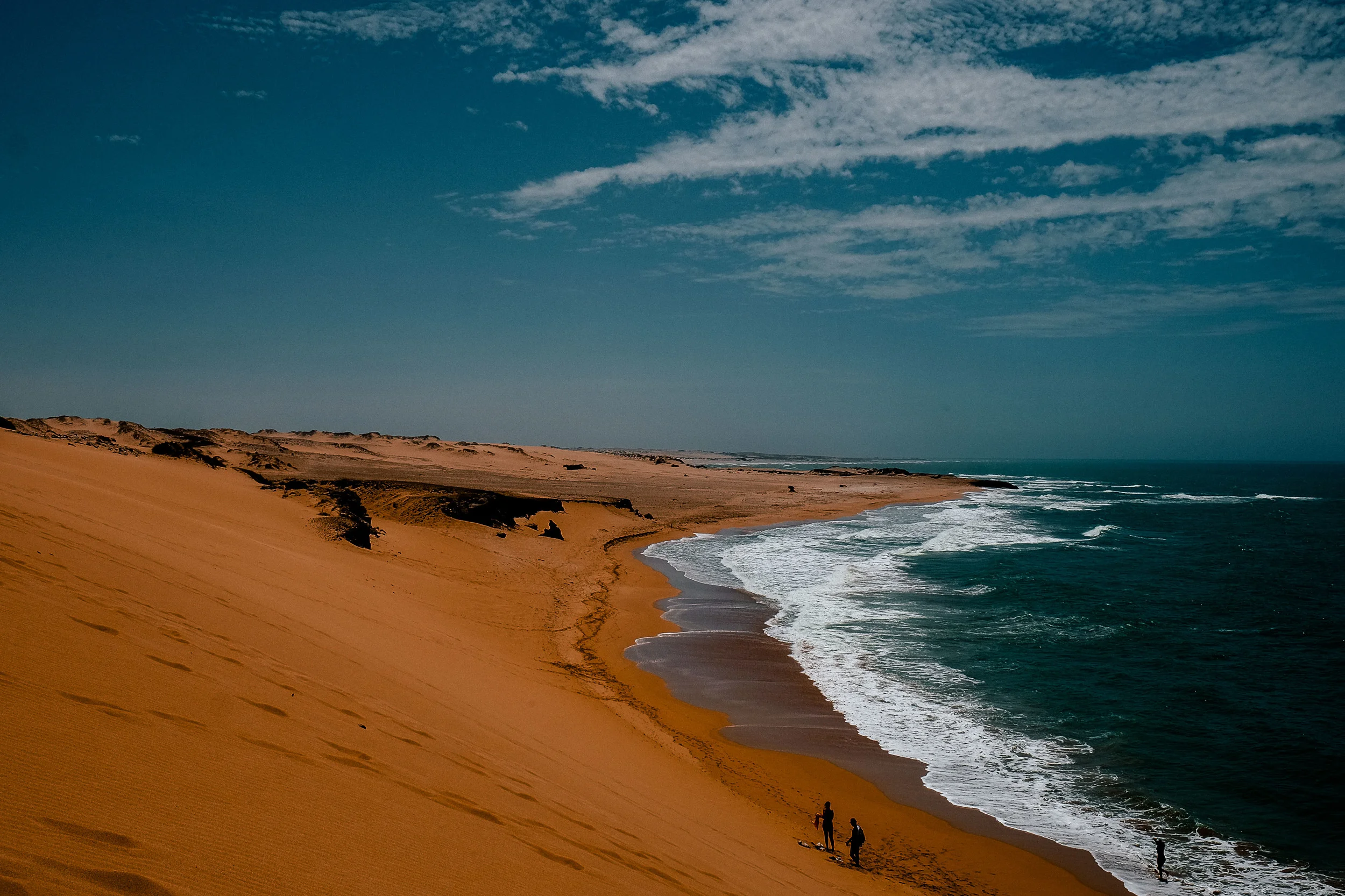 An impressive view of the vast desert dunes meeting the Caribbean.