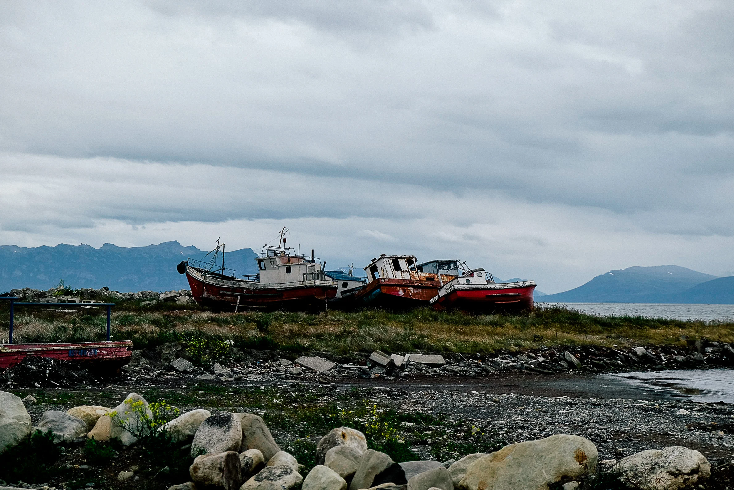 We spent a couple of days in Puerto Natales, a primary transit point for entering the National Park - Torres Del Paine. Down by the docks is a small graveyard of decommissioned boats against a backdrop of mountain peaks.