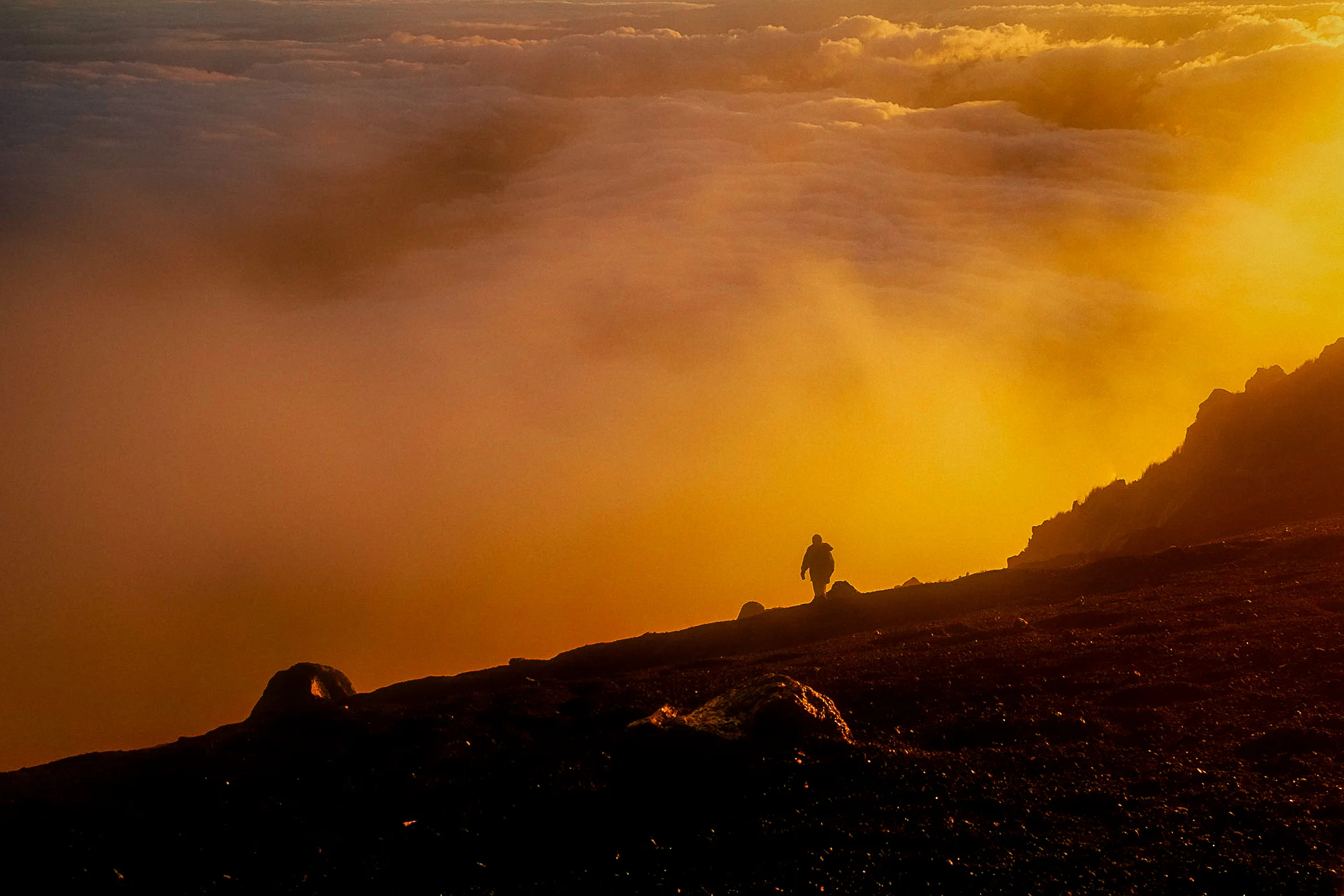 The sun rose and set the clouds on fire as we made our final climb to the peak.