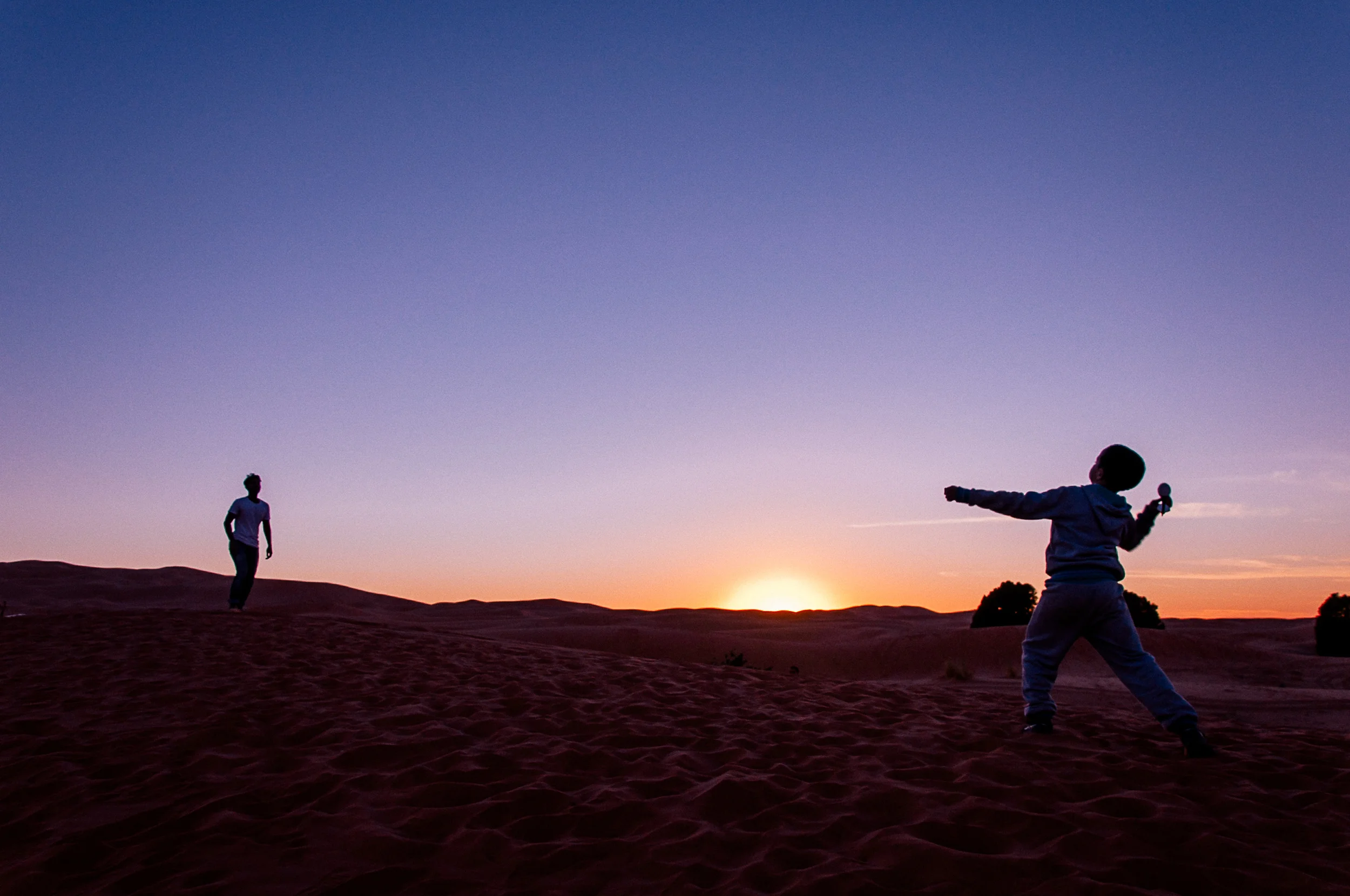 Before leaving the Sahara desert, we played catch with some of the local children.
