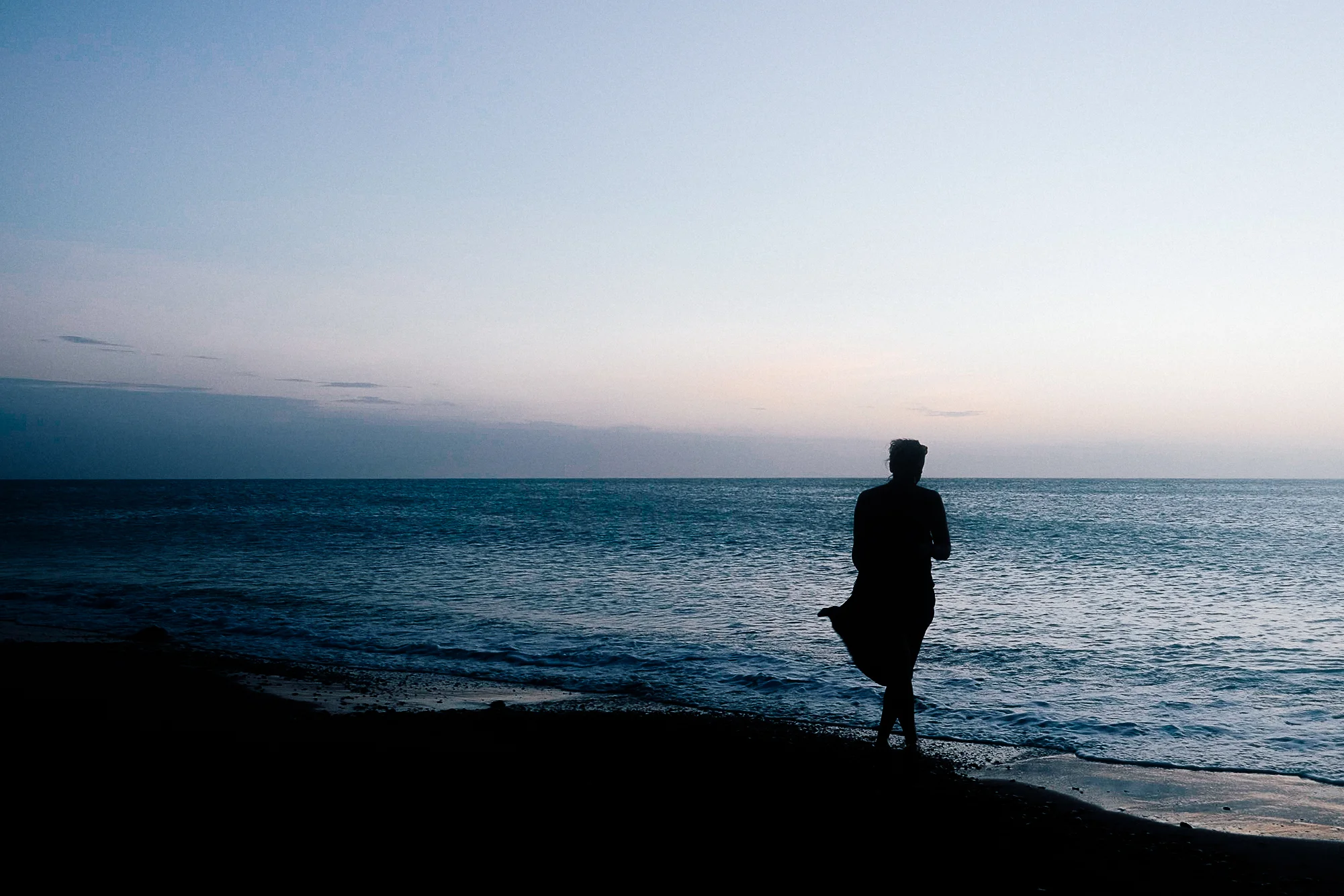 Sabrina walking the beach.