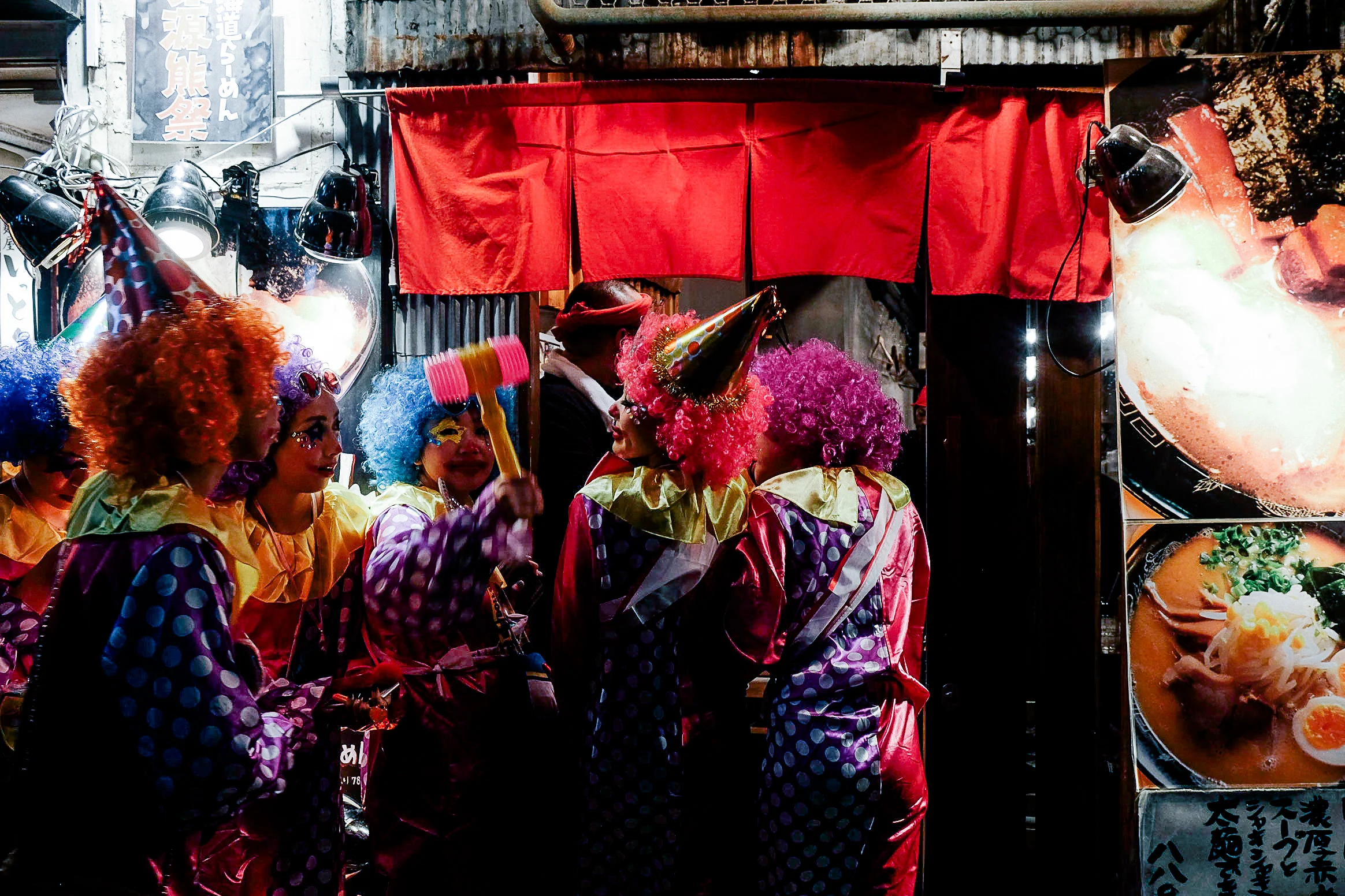 Hungry clowns lining up for a late night snack.