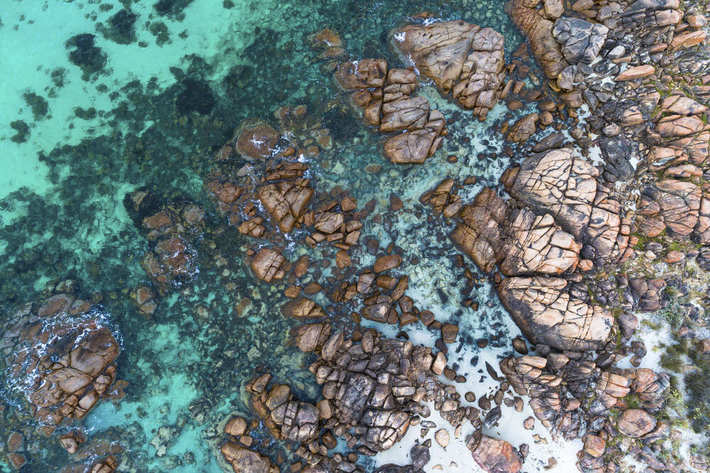 Rocks Stones on Sandy Beach with Turquoise Water