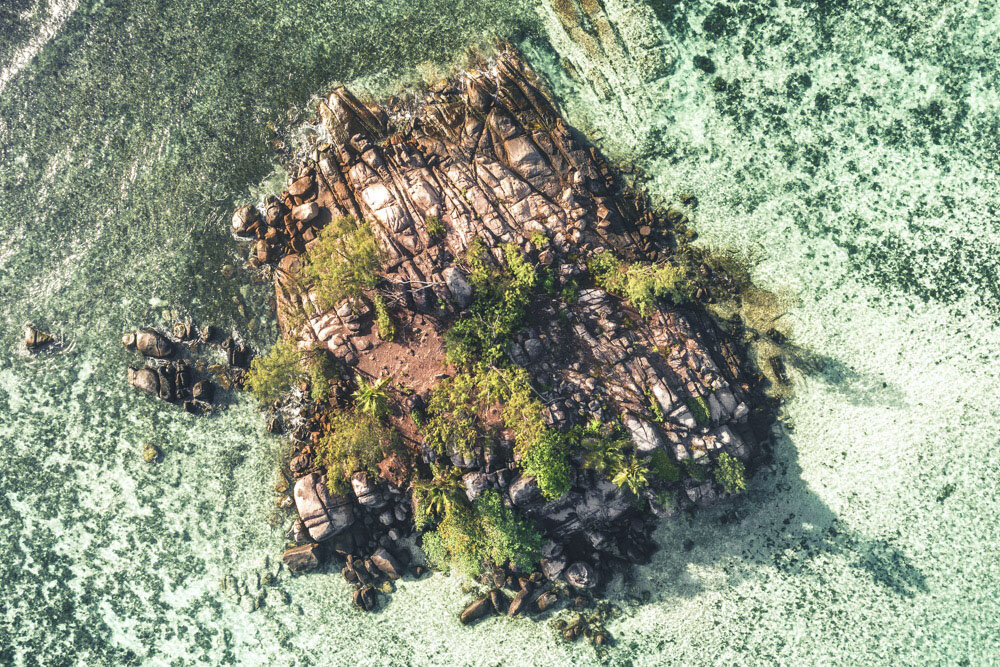 Lonely Paradise Island Surrounded by Turquoise Water - Drone Photo