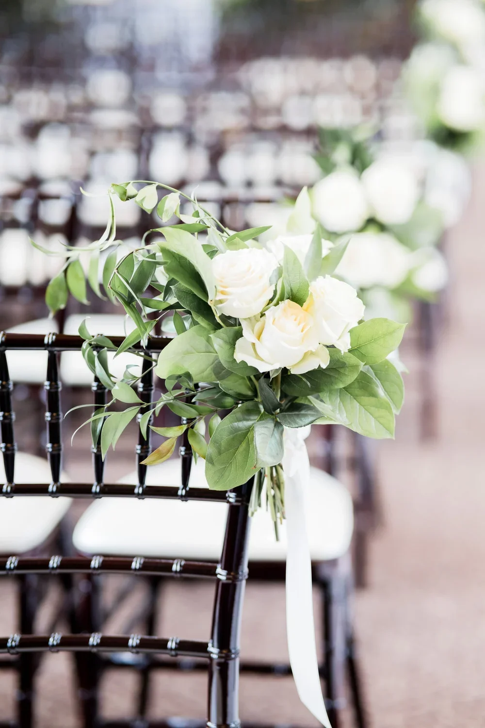 Elegant White and Green Ceremony Chair Flowers