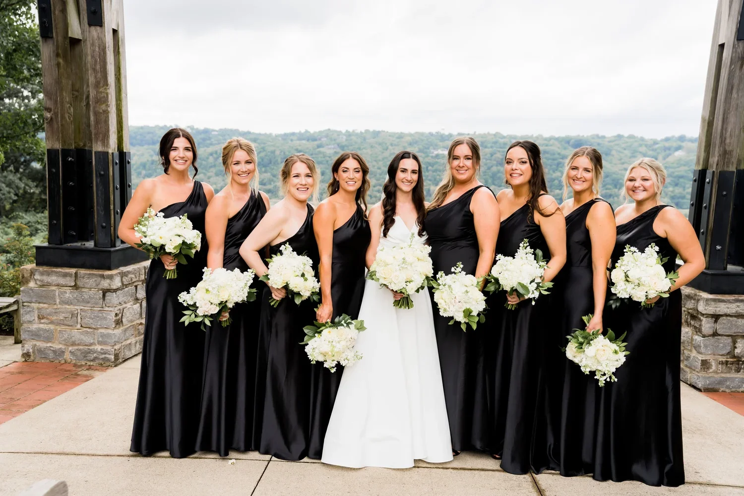 Bridal Party with White Bouquets and Black Dresses