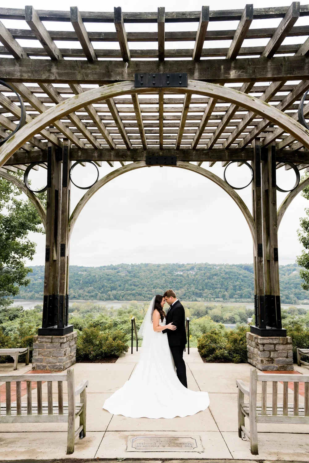 Romantic Kiss Under Outdoor Arch