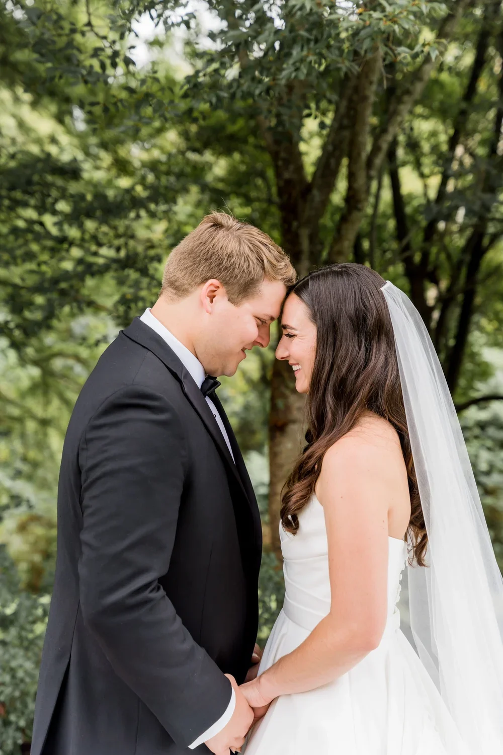 Bride and Groom with Foreheads Together