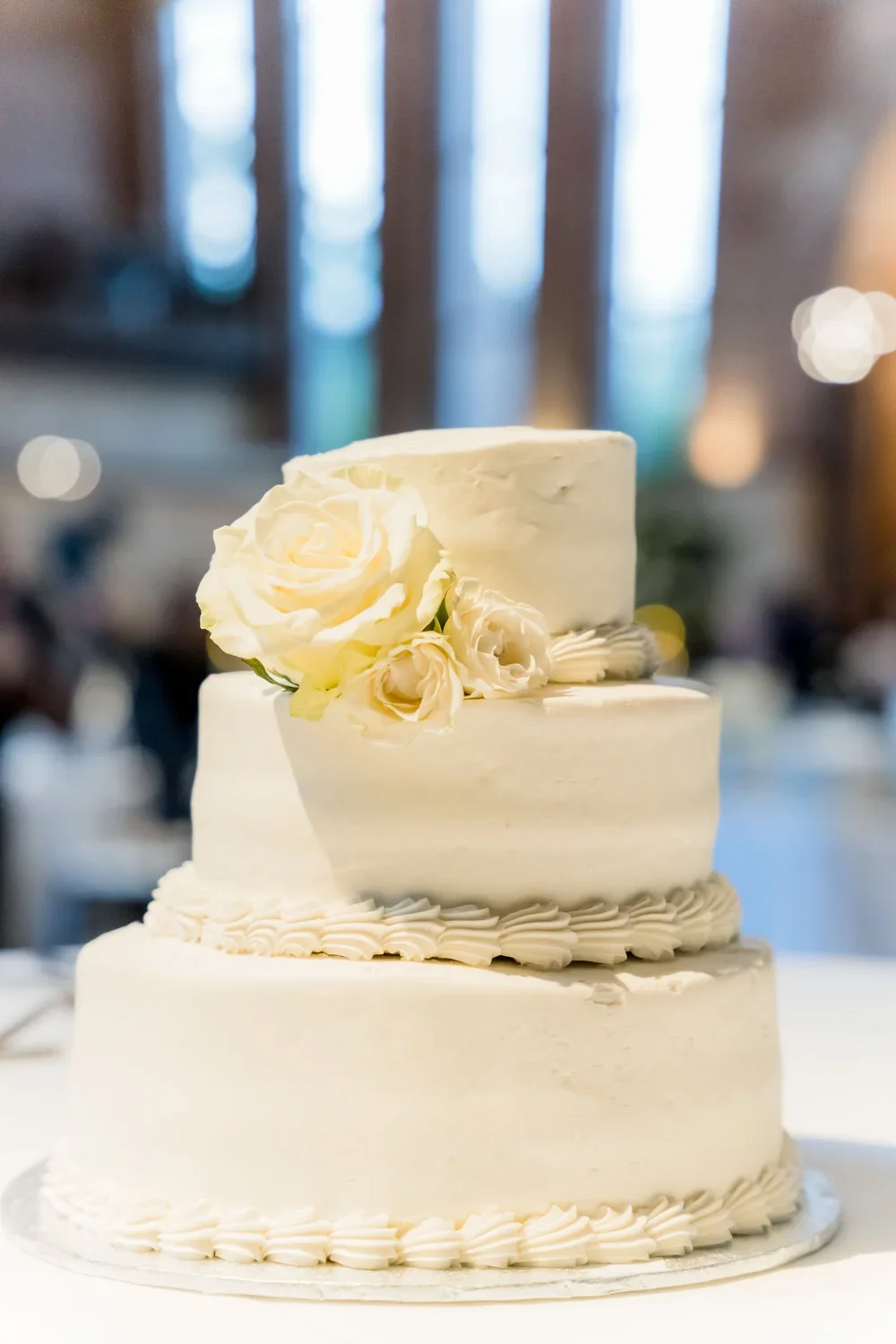 White Wedding Cake with Floral Accent