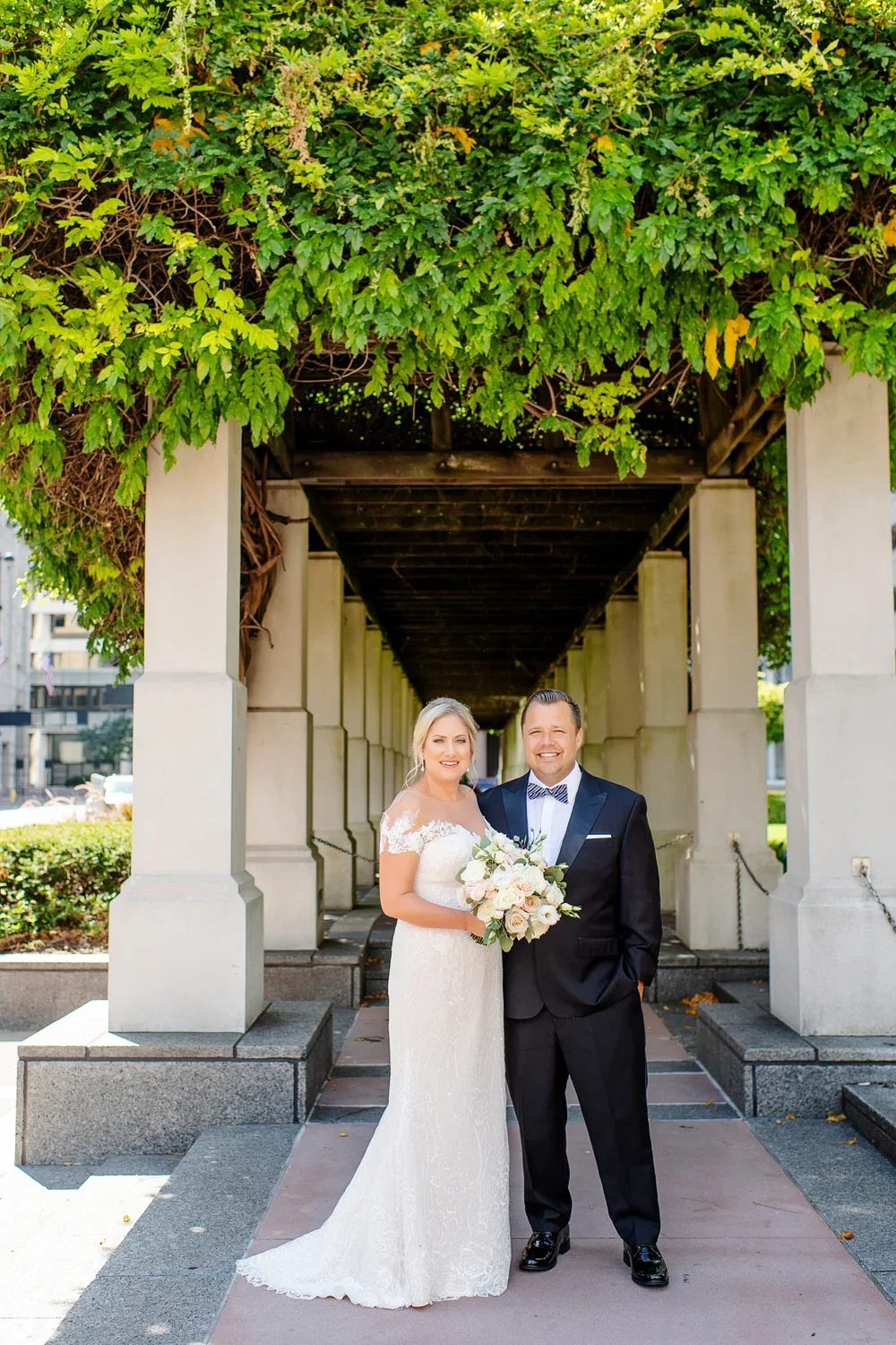  Bride and Groom Portrait in Garden Archway