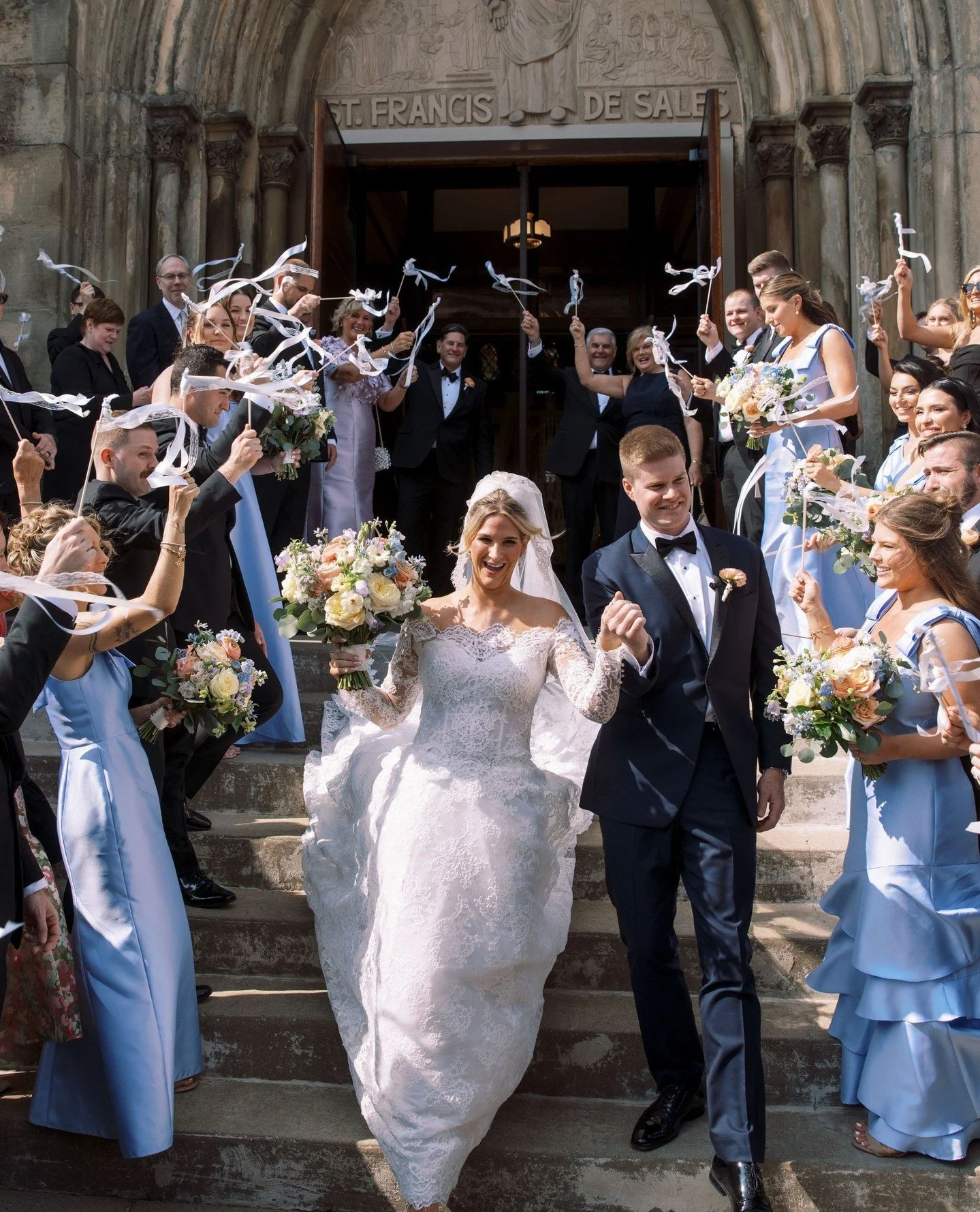 Get ready for a feast of the eyes. We open with ⁠Stephanie &amp; Dan surrounded by family, friends, ribbon wands, laughter, and so much joy, as they walked out of St. Francis de Sales ready to celebrate their life together.⁠
⁠
Vendor Team⁠
Photograph