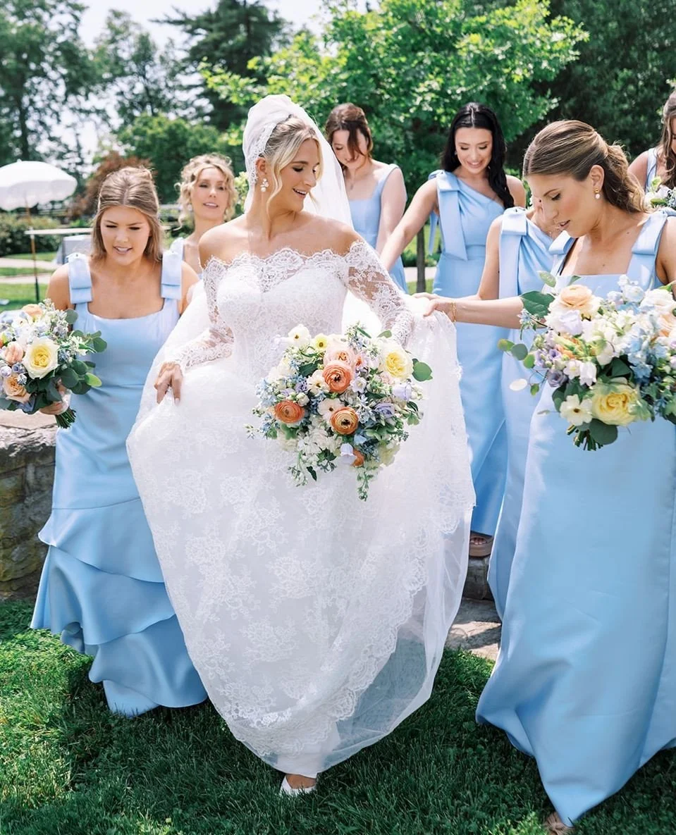 We are loving this bridal party style! The beautiful blue dresses paired with bouquets in soft blues and subtle hints of cream and golden peach, made such a stunning statement.  Stefanie looked radiant surrounded by her best girls. Truly a picture-pe