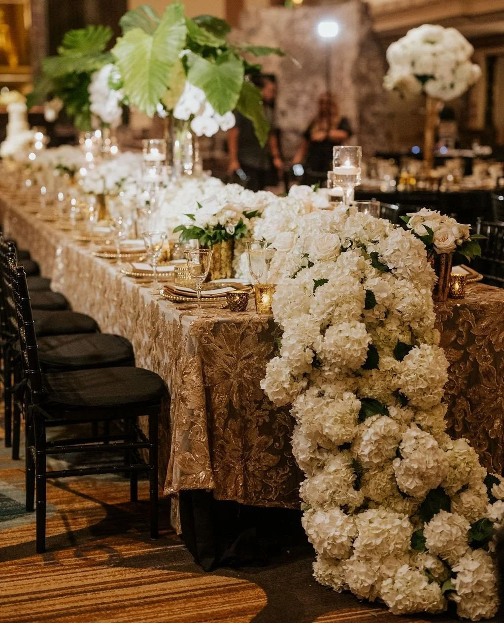 Tables overflowing with hydrangeas and candlelight turned the Hall of Mirrors into a floral dreamscape.⁠
⁠
Vendor Team:⁠
Venue: @hiltonnetherlandplaza⁠
Floral Design: @clflorals⁠
Photography: @anna_may_photography⁠
Coordinator: @eleganteventsbyelisa