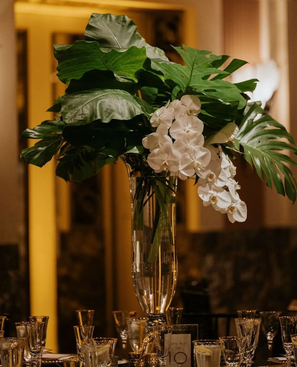 Tall golden stands lifted full clouds of white hydrangea and roses high above the tables, creating a canopy of elegance in the ballroom.⁠
⁠
Vendor Team:⁠
Venue: @hiltonnetherlandplaza⁠
Floral Design: @clflorals⁠
Photography: @anna_may_photography⁠
Co
