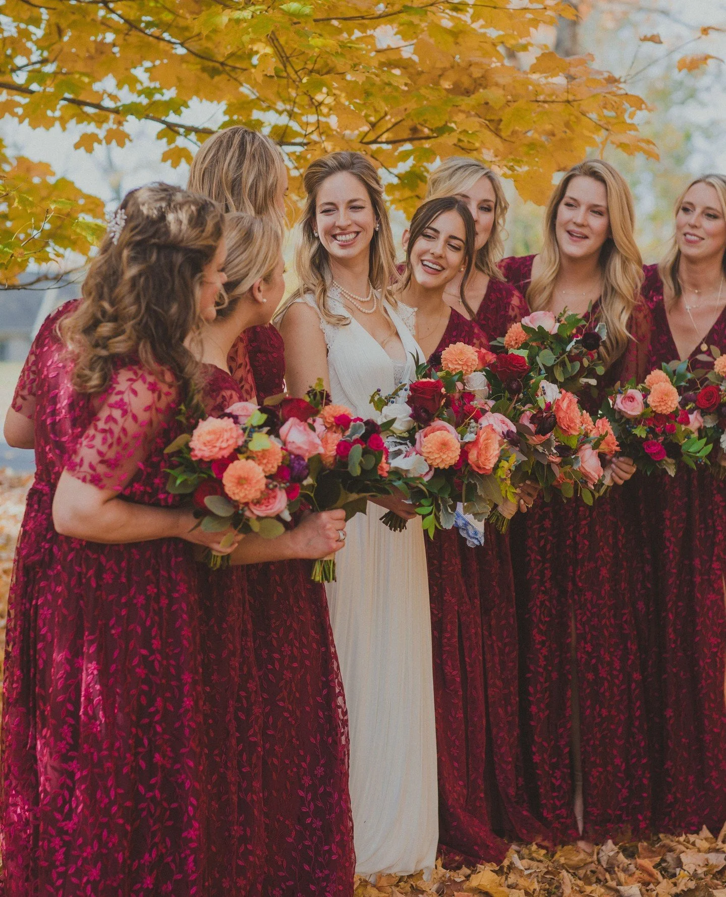 Gorgeous burgundy gowns with bold Fall tones....yes please!  Nora &amp; Mark could not have picked a better time of year to have their gorgeous wedding!⁠
⁠
Vendor Team:⁠
Floral Design: @clflorals⁠
Photography: @kulturedphotography⁠
String Music: @str