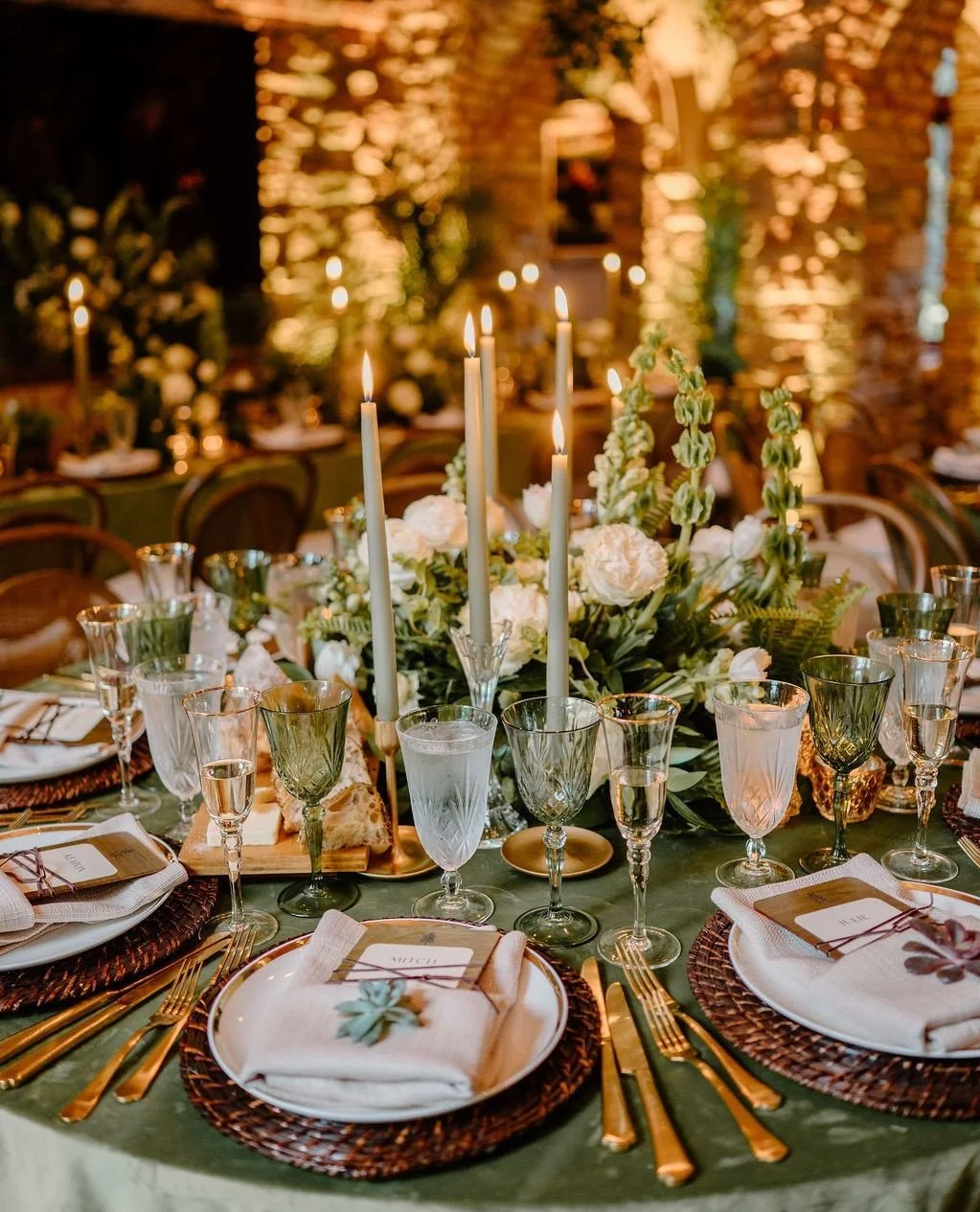 We will never stop swooning over this reception room setup. The candlelight, the gold flatware, the green taper candles, and the velvet linens are just a few CLF favorites. ⁠
⁠
Vendor Team:⁠
Floral and Event Design: @clflorals⁠
Wedding Coordinator: @