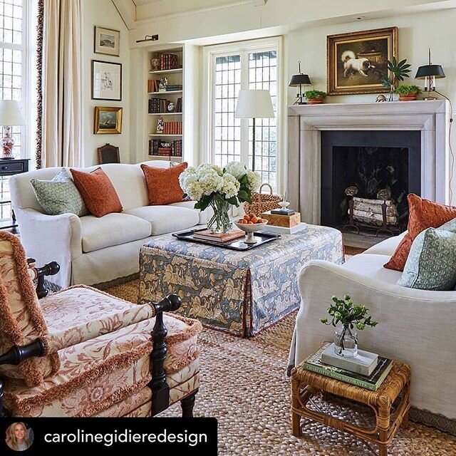 #repost Interior design by @carolinegidieredesign and architecture by @billingramarchitect for a beautiful and chic Alabama client. We love Caroline&rsquo;s use of persimmon, peach and blue/grey in our pretty book-lined living room with tall leaded w