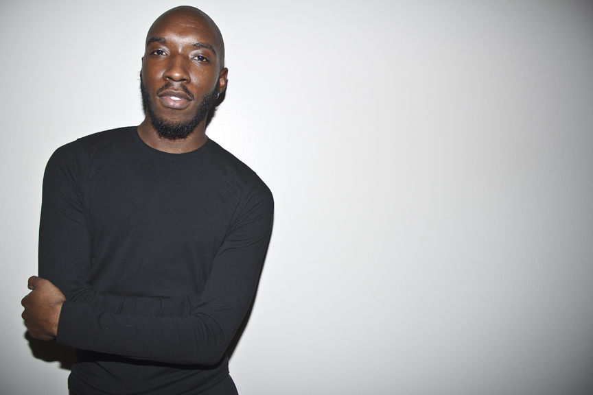 Marcus Donaldson, arms folded, looking at camera. photography: Benjamin Moten