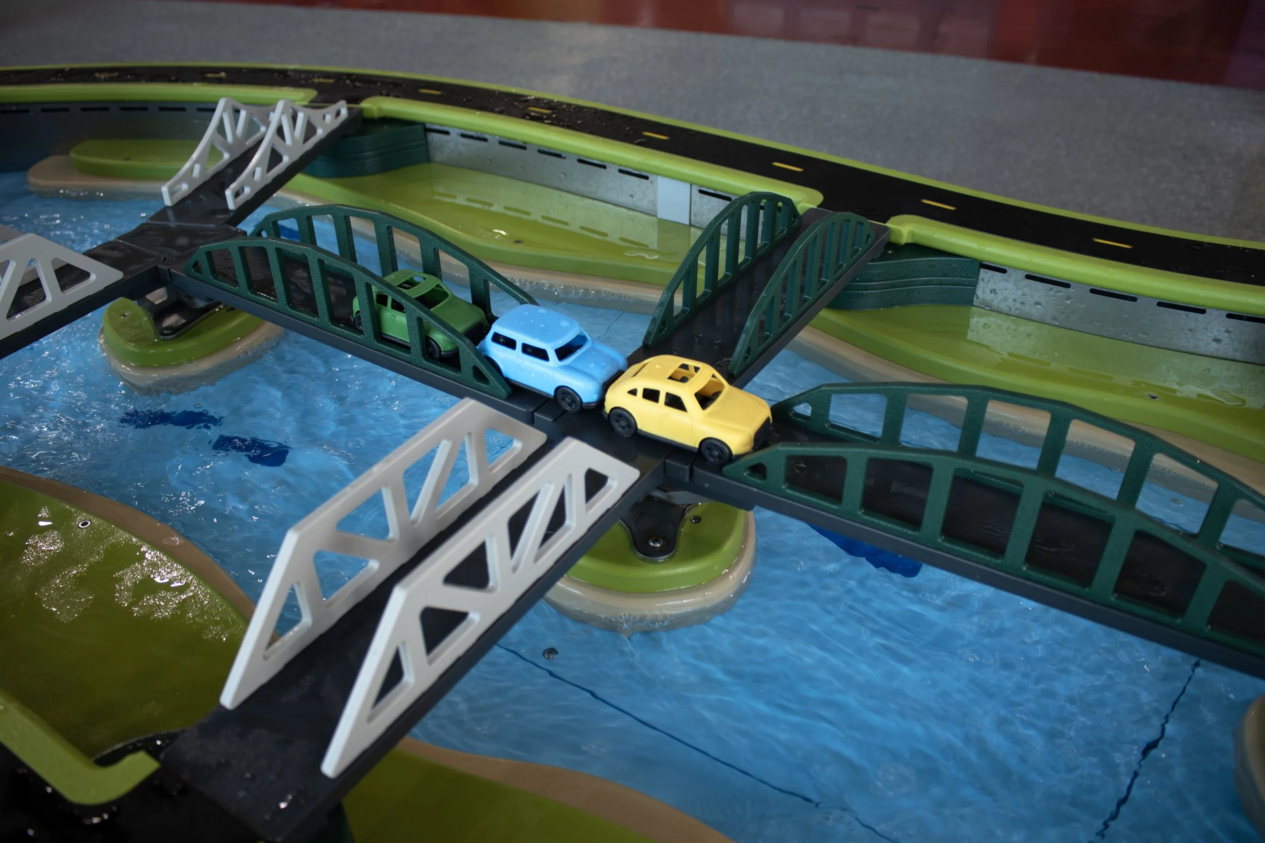 Roadway and moveable bridge over water table.