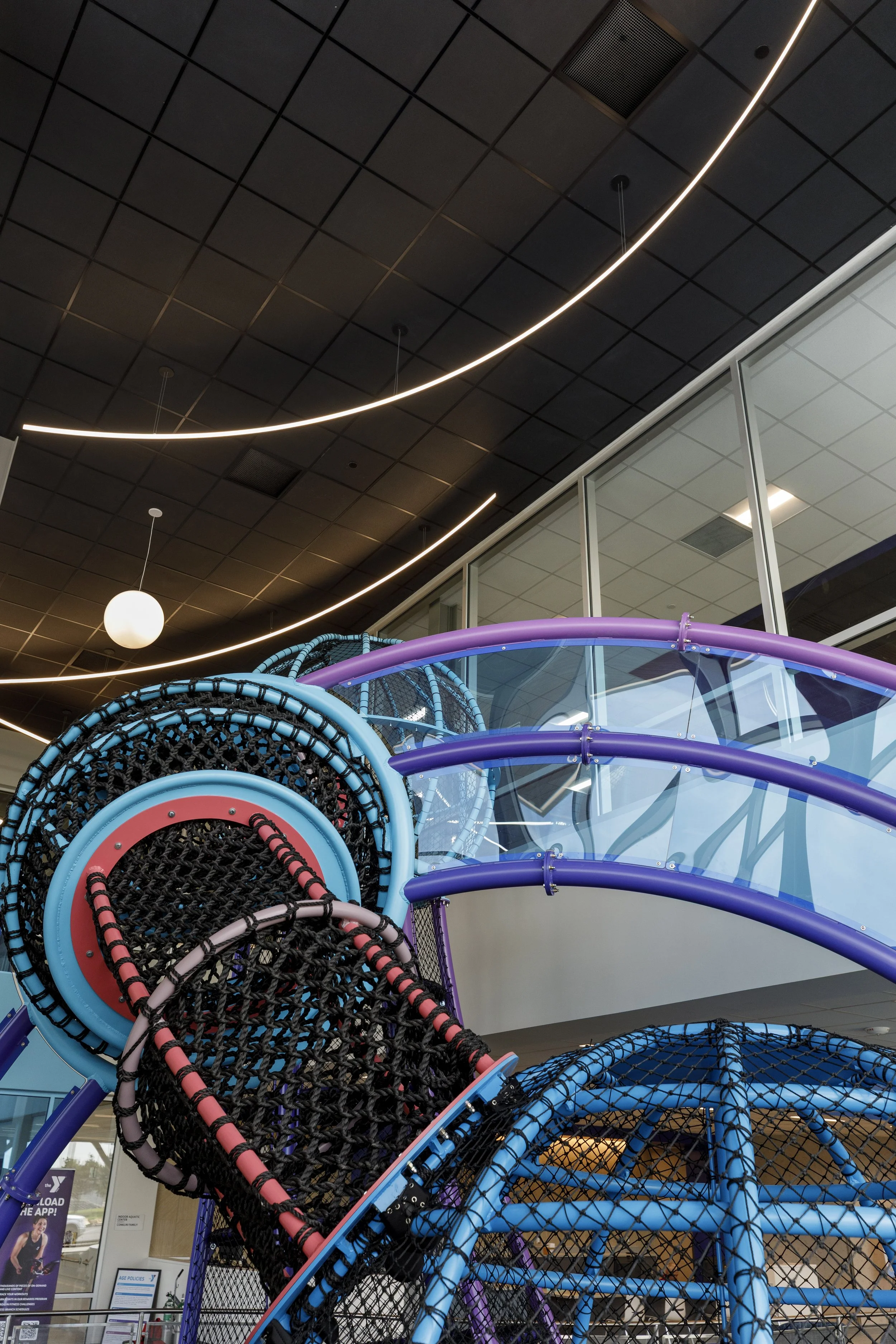 Curving metal climbing structure in the YMCA Hutchinson location