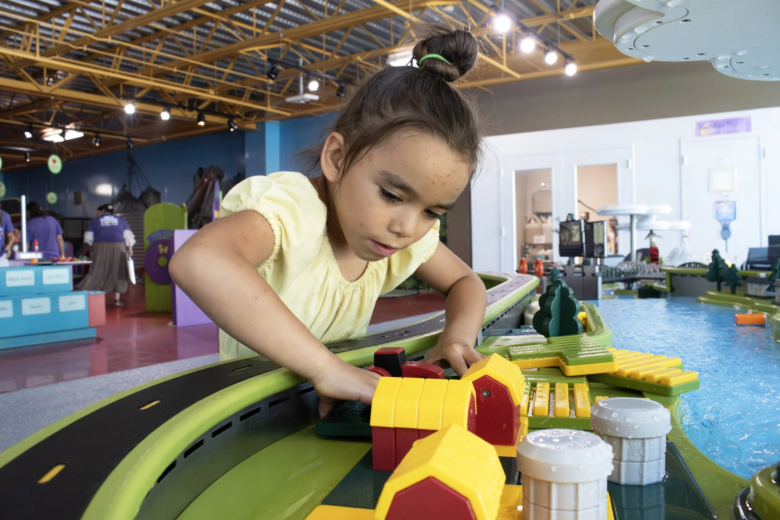 pretend play farm on water table in children's museum.