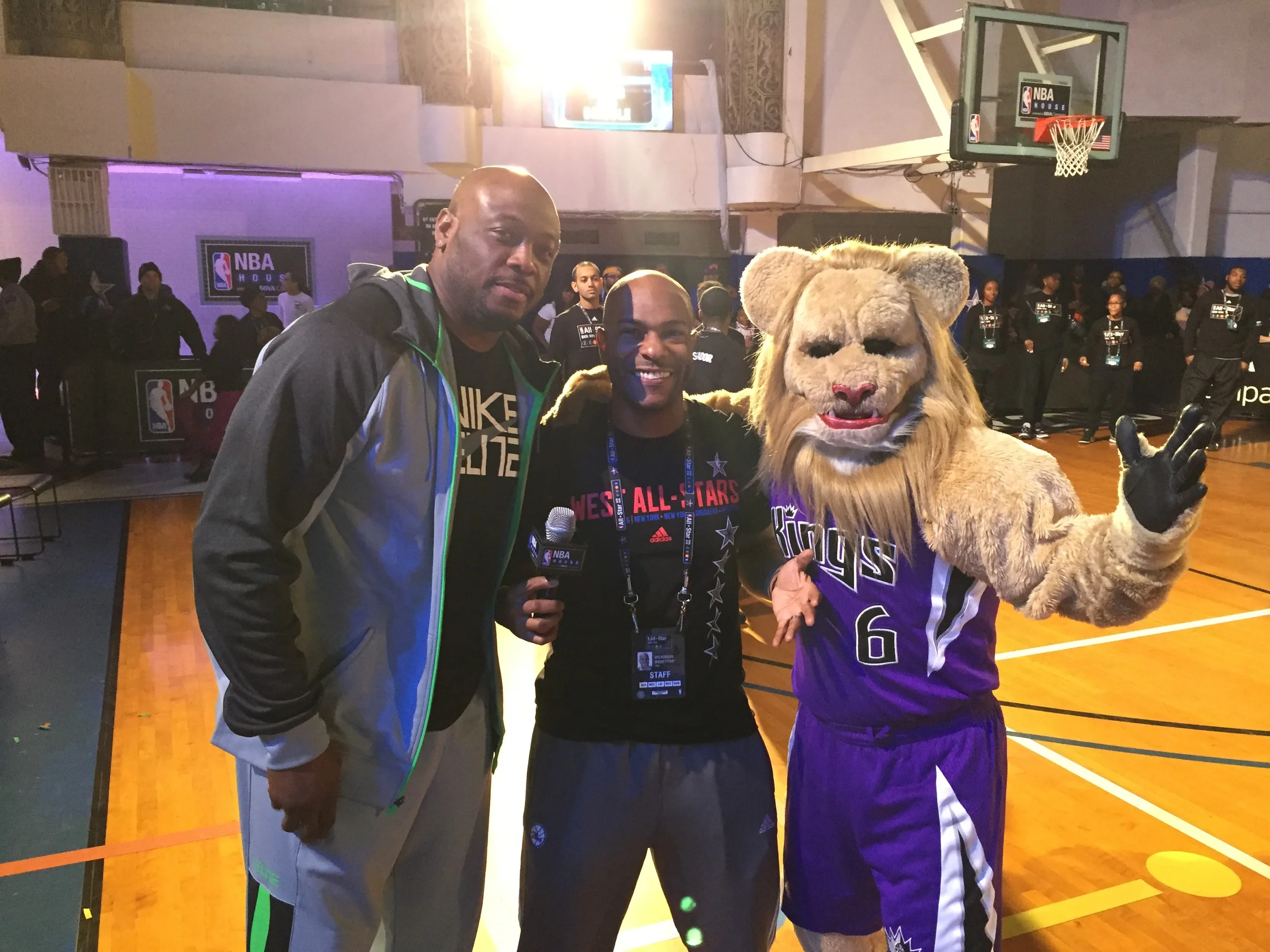NBA Legend and mascot appearances were just a fraction of the action at NBA House. Here, event emcee, Wil, poses with Kings mascot Slamson and Legend Mitch Richmond.
