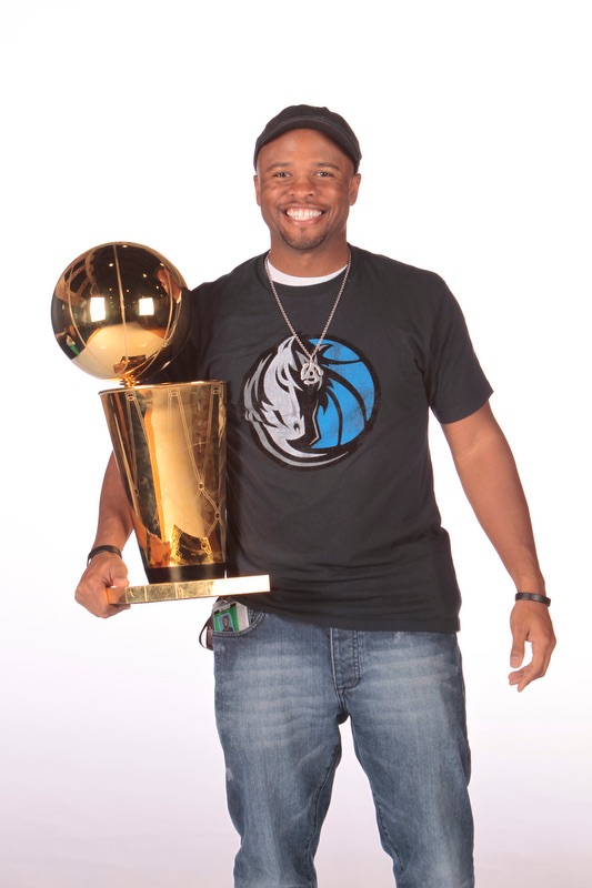 Ro poses with the Dallas Mavericks 2011 NBA Championship Trophy. 