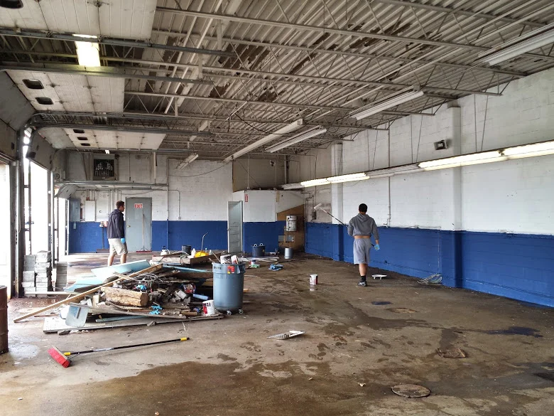 The crew working hard painting and cleaning up our new shop!