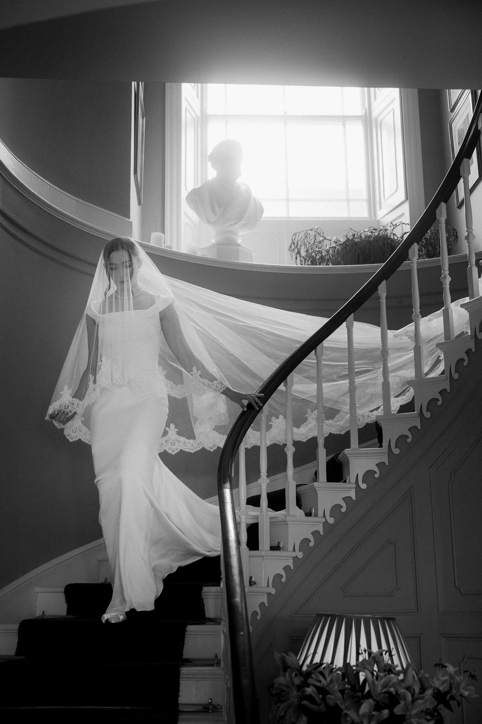 tullyveery house wedding photography Bride descends stairs in main house