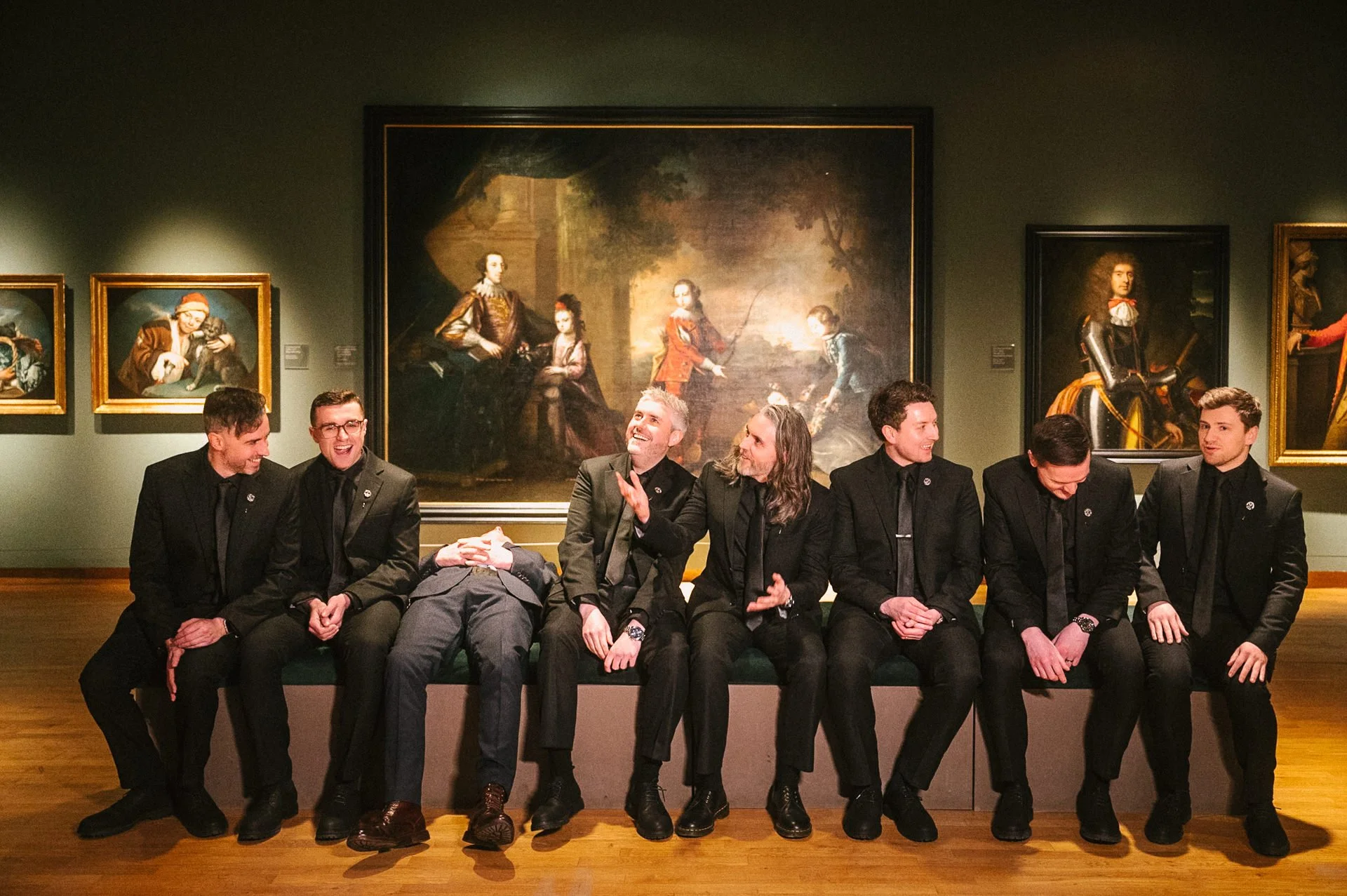 Playful groomsman wedding portrait in the picture gallery at Ulster Museum