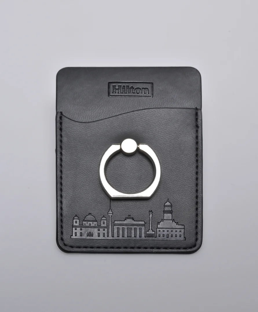 brandcraft_privatelabel_merchandise_agency_supplier_logo_emboss_die_punch_leather_artificial_leather_pu_packaging_packaging_premium_unique_individuell_hilton_domhotel_berlin_handy_sticker_ring_smartphone_AJH_7011x.jpg